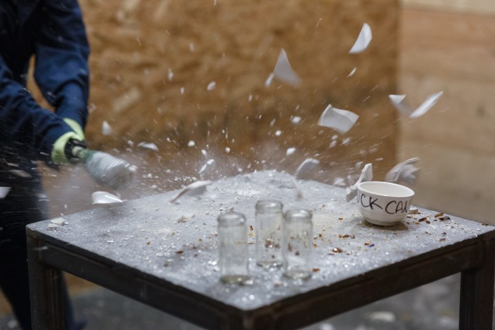 a person doing a trick on a wooden table